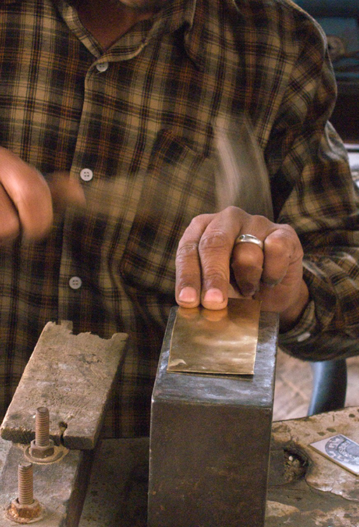 Newar Artisans - silversmith working with a traditional drill